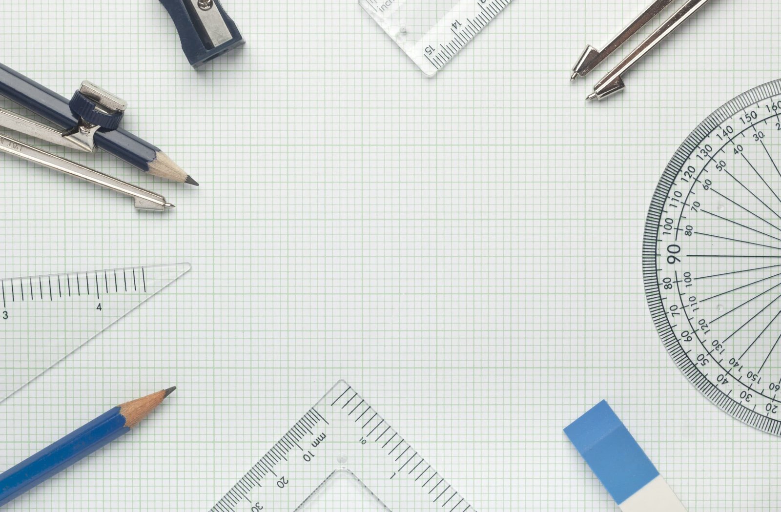 pencil, protractor, rulers all forming a circle