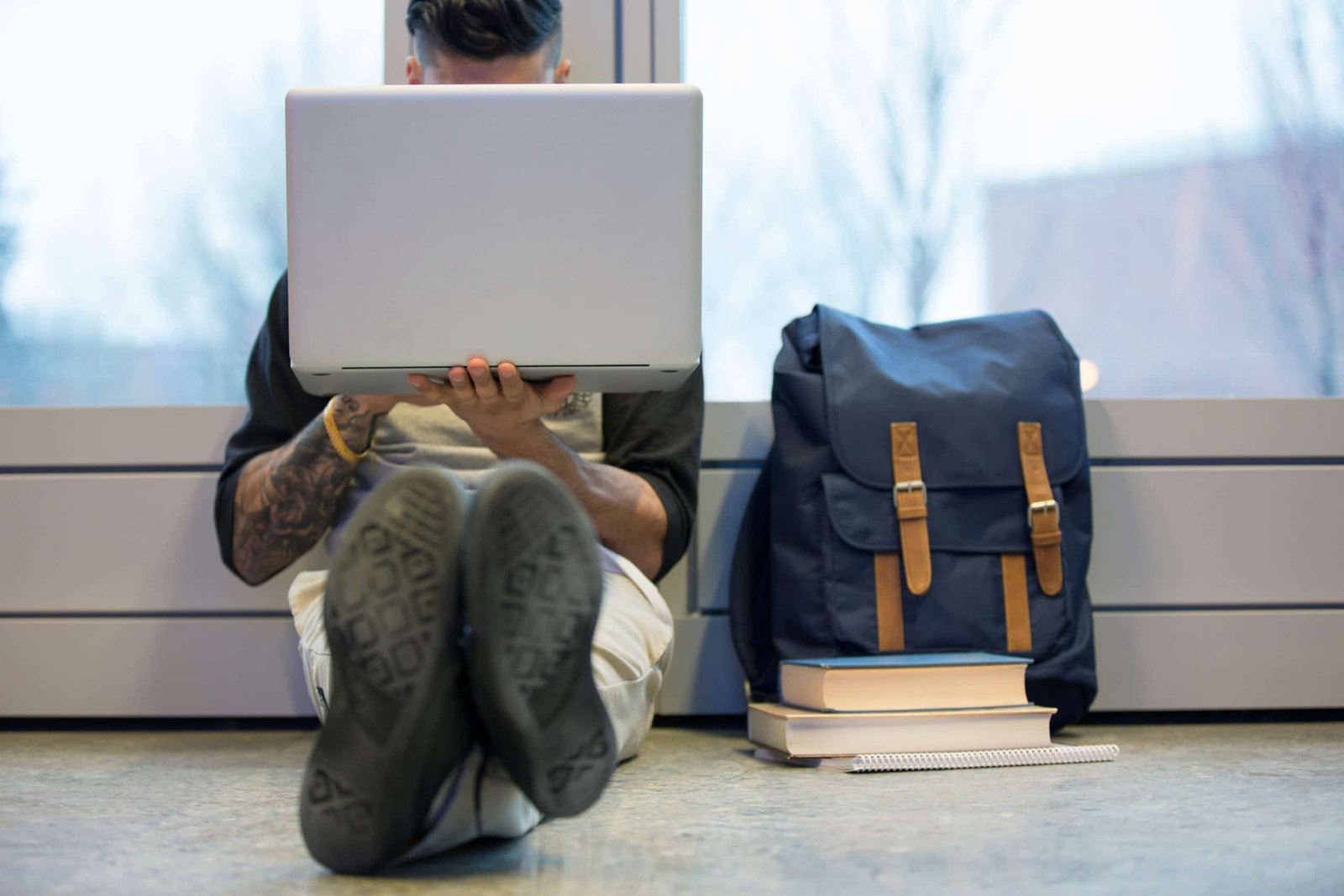 Person sitting on the couch looking at their computer
