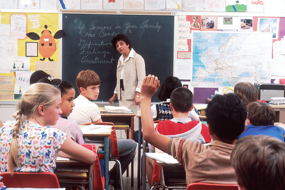 decorative image of classroom with student raising hand