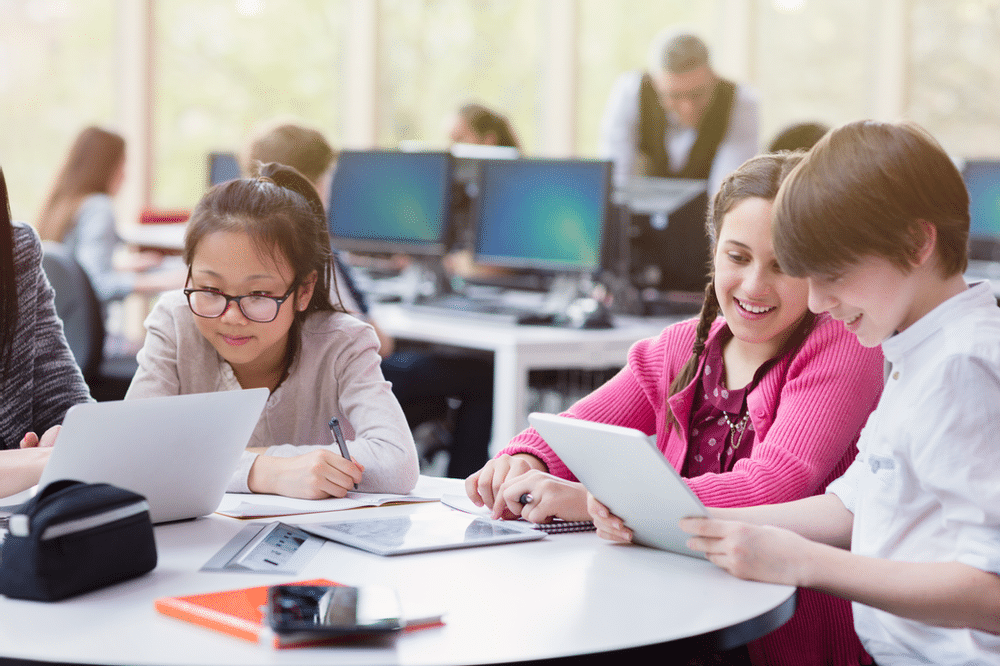 Students studying and discussing around a table