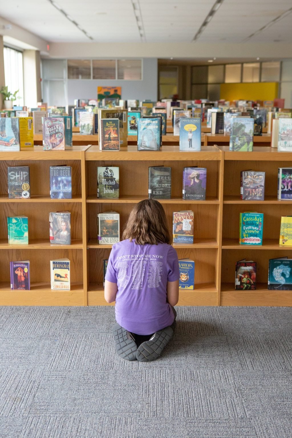 Girl picking library book