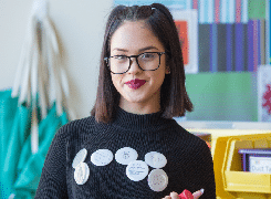 Girl student with glasses smiling at camera