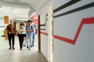 Students walking down a school hallway