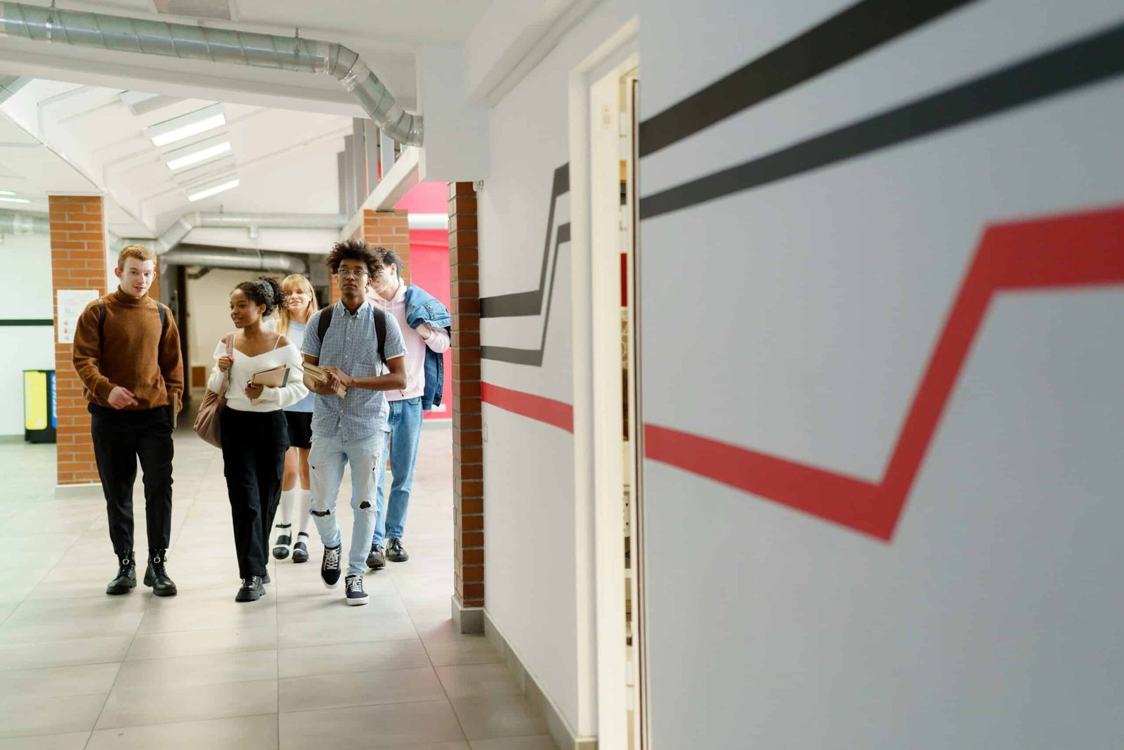 Students walking down a school hallway