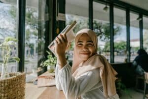 Student holding up a book
